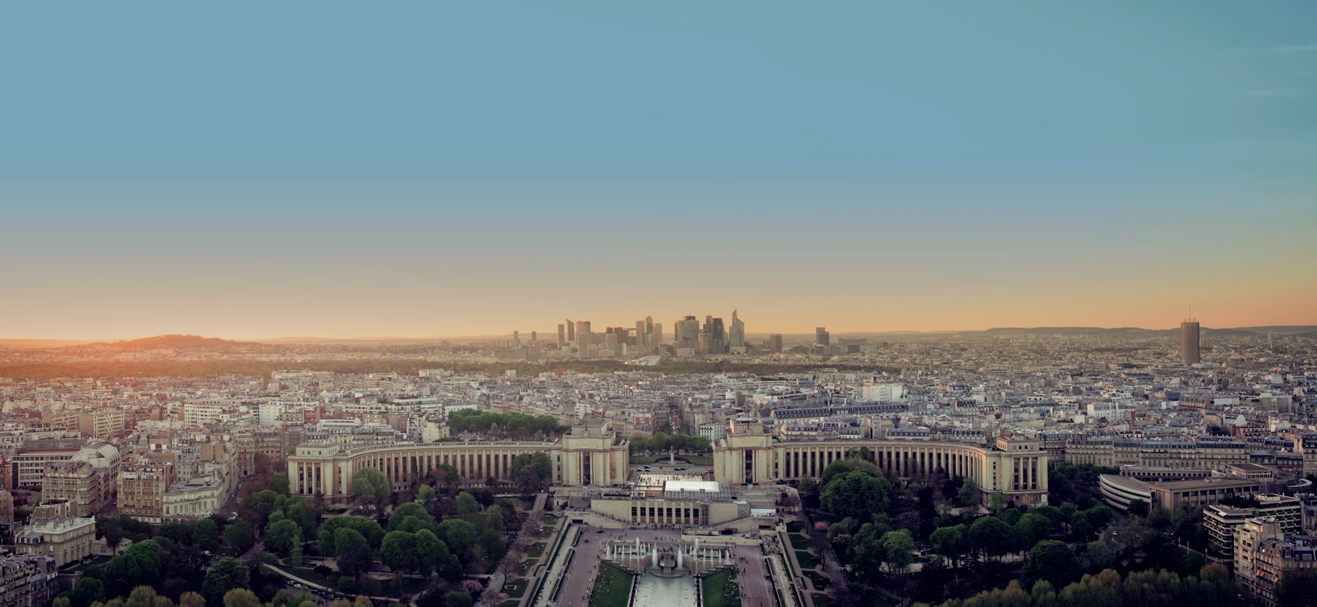 An aerial view of a city at sunset